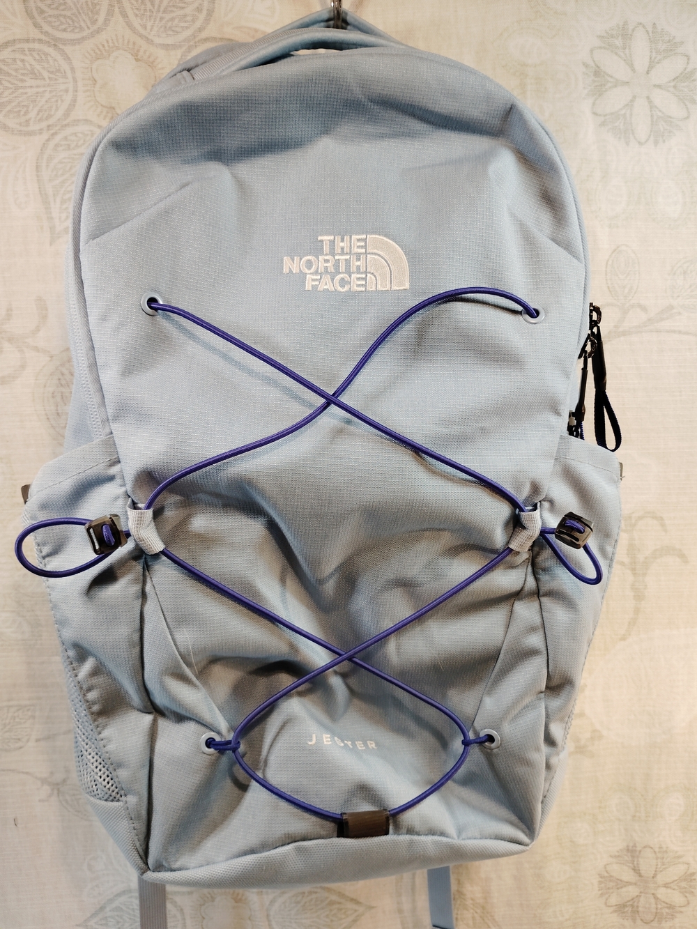The North Face Light Blue Backpack with Purple Bungee
